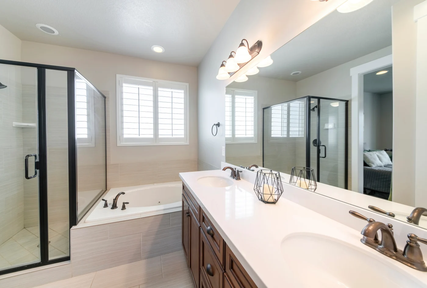 Interior Of A Master Bathroom With Double Vanity Sink And Windows Interior Of A Master Bathroom With Double Vanity Sink And Windows