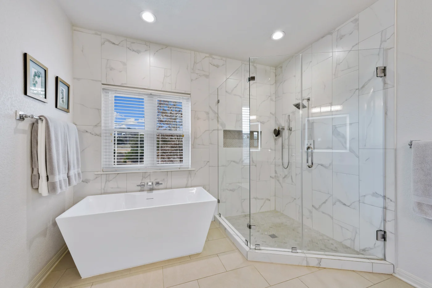 Gorgeous bathroom with bathtub and shower and recessed lighting