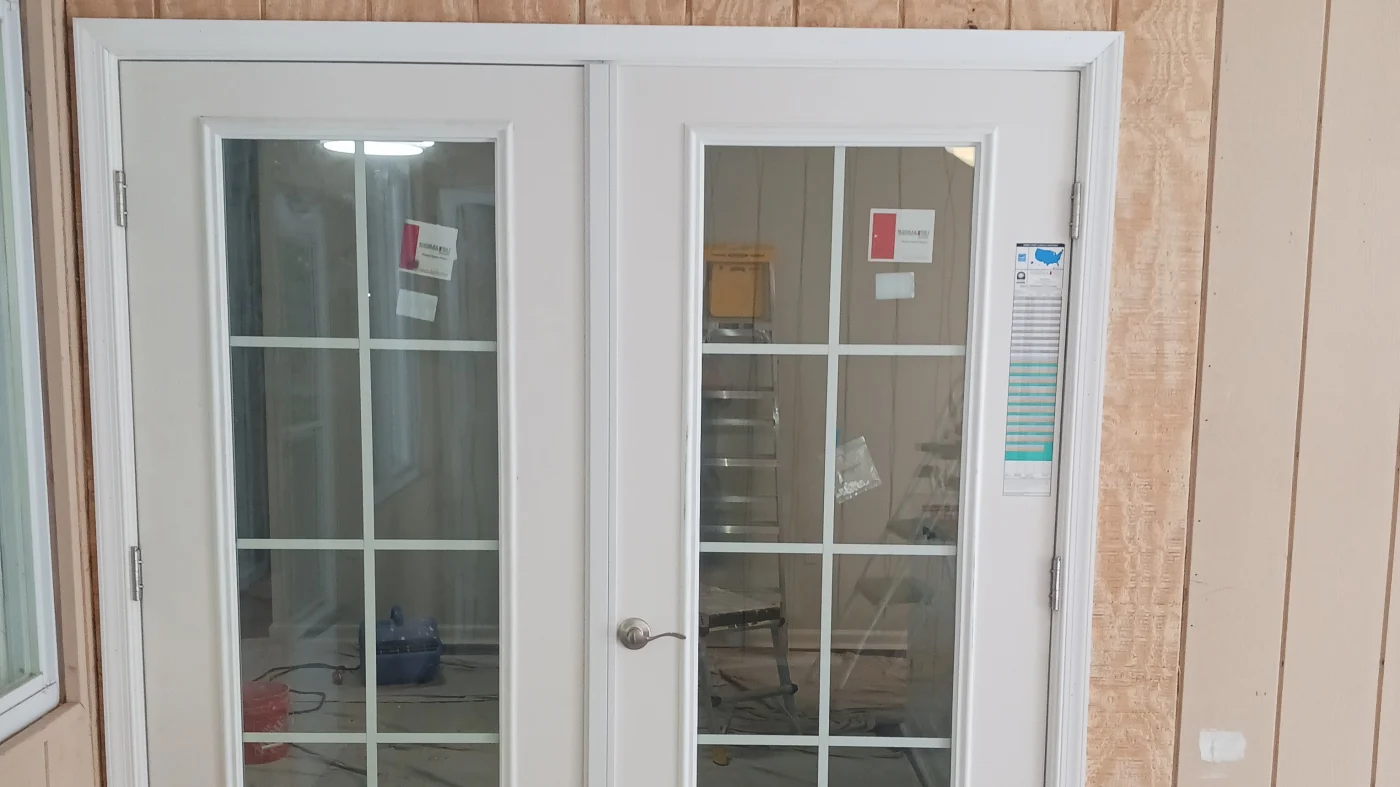 Amazing Interior Remodeling Company In Georgetown, DE | Mast Contracting Newly installed white French doors on a home exterior.