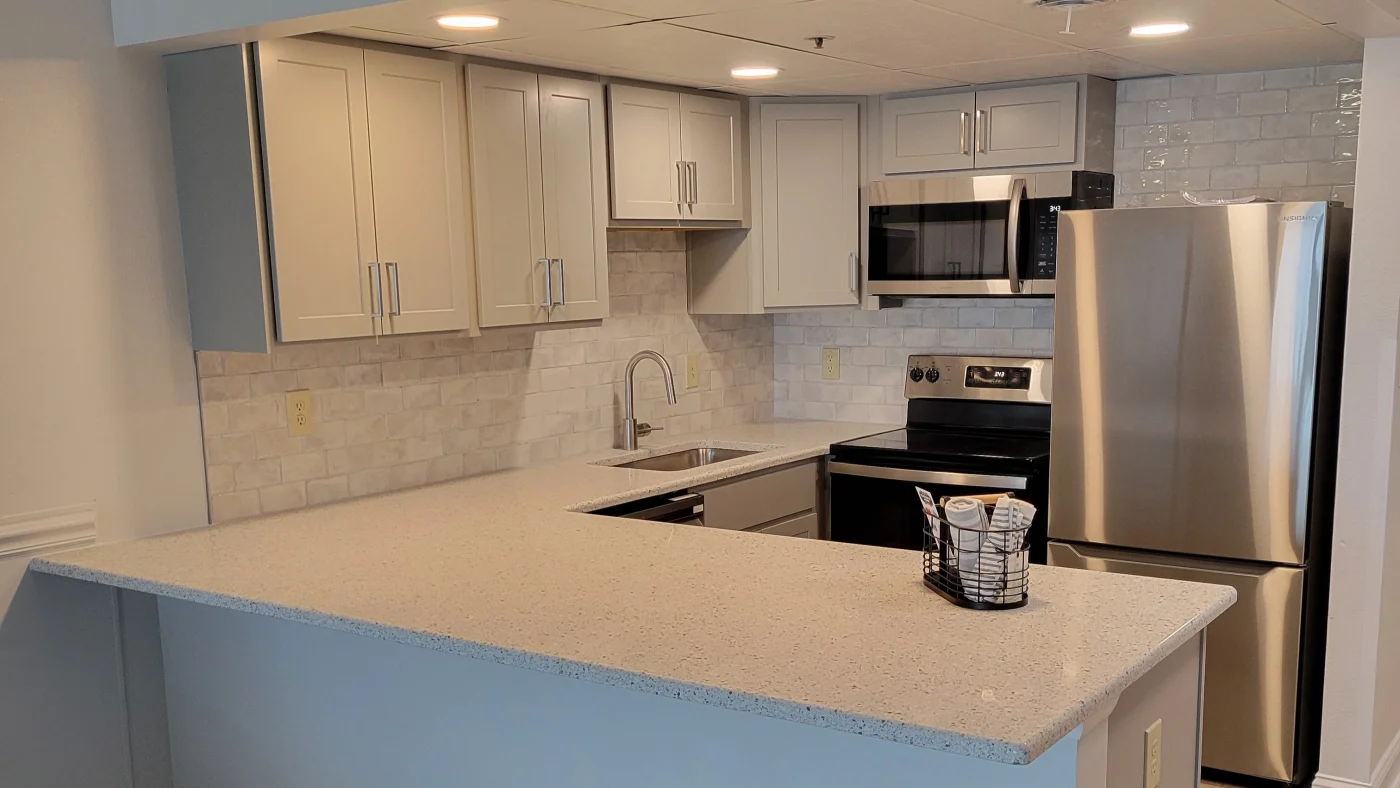 Best Kitchen Remodels In Selbyville, DE | Mast Contracting Beautiful new white kitchen remodel with subway tile and white cabinetry.