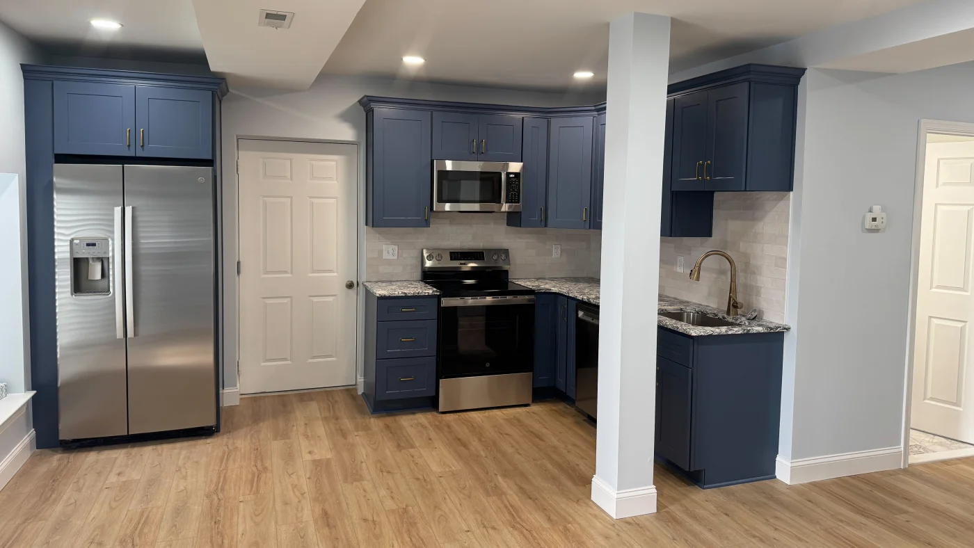 Expert Kitchen Remodel Berlin Md Mast Contracting Beautiful new kitchen remodel with blue cabinetry, wood flooring, and beautiful stone countertops